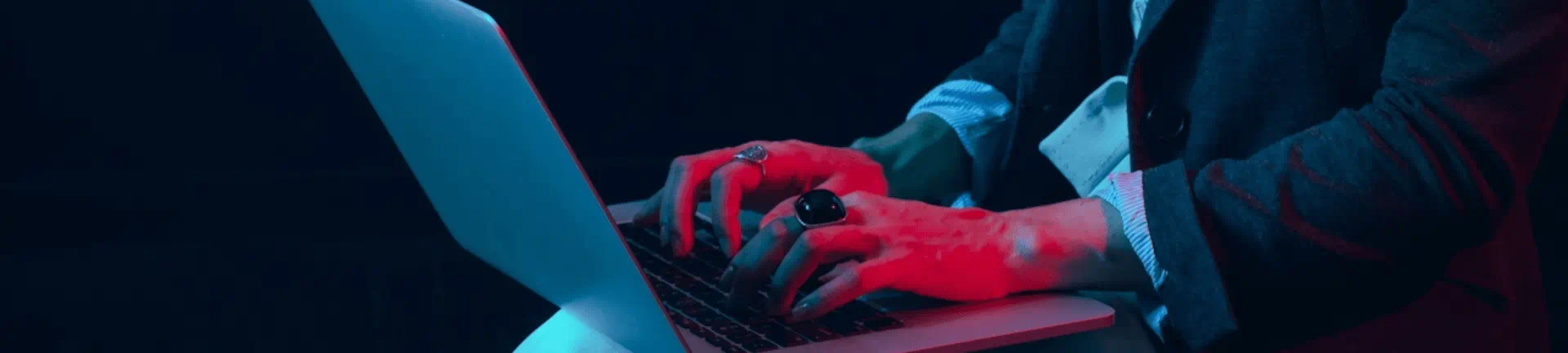 A person focused on typing at a laptop, illustrating the role of MSP and RPO solutions in enhancing productivity.