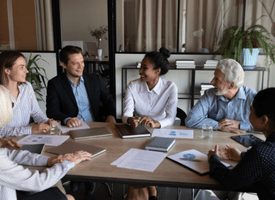 A diverse group of workers in an office setting.