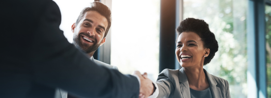 A handshake between two business individuals in an office, representing trust and integrity in their collaboration. A handshake between two business individuals in an office, representing trust and integrity in their collaboration.