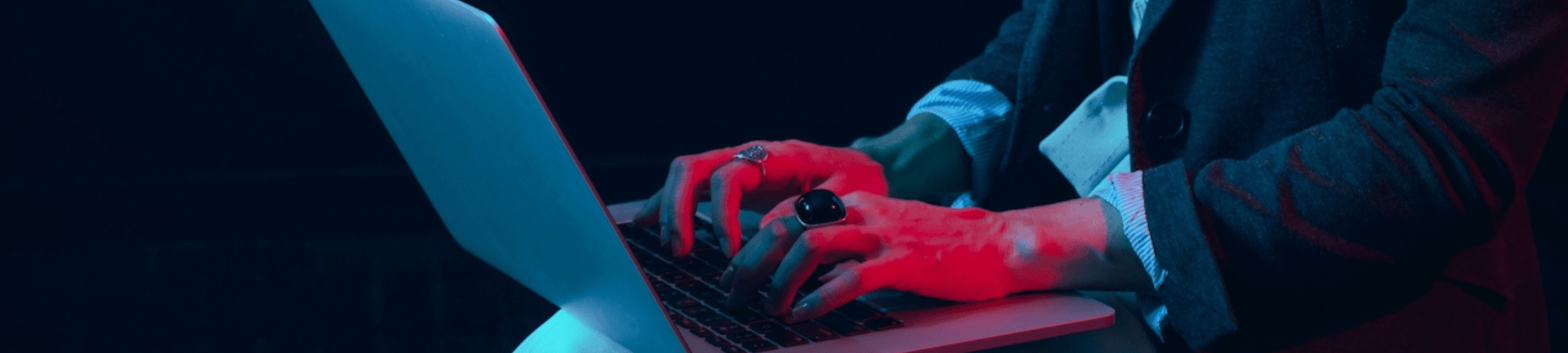 A person focused on typing at a laptop, illustrating the role of MSP and RPO solutions in enhancing productivity.