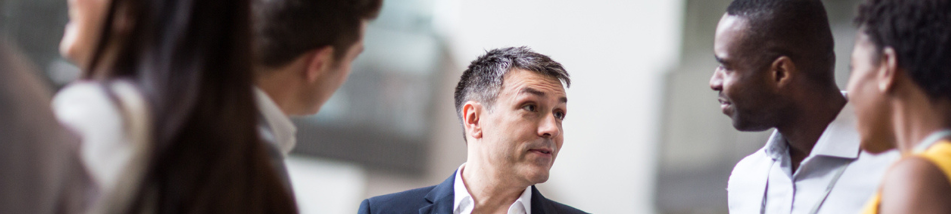 Two professionals standing next to each other in a room, collaborating on workforce MSP solutions. Two professionals standing next to each other in a room, collaborating on workforce MSP solutions.