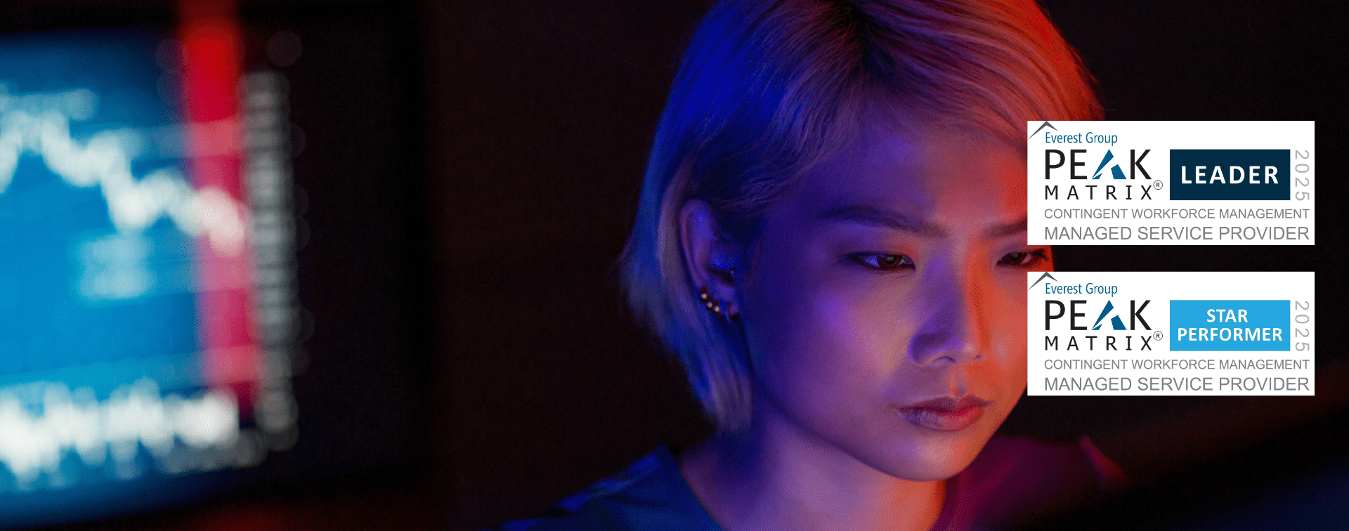 Female tech professional looking at a computer screen