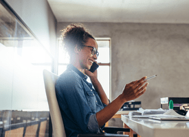A woman sitting at her desk in the office 
