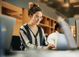 a woman sitting at her desk in the office